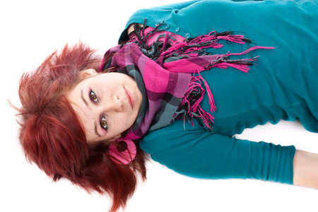 Teenager girl lying in floor and lokking on cameraの写真素材