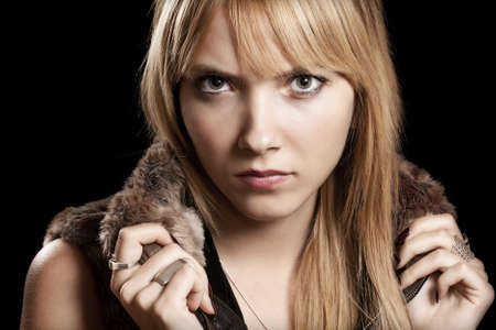 Seductive blond woman isolated on black background の写真素材