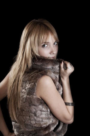 Seductive blond woman isolated on black background の写真素材