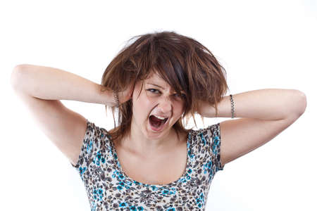 Angry woman is screaming out loud and pulling her hair. 
