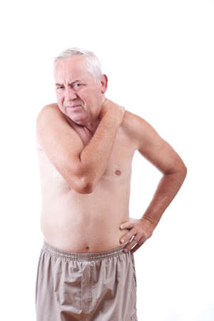 Senior man with neck pain, isolated in whiteの写真素材