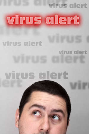 Men's head closeup and virus alert text, conceptual imageの写真素材