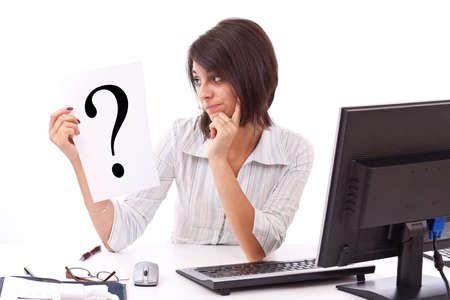 Portrait of confident business woman with question mark sign on white background の写真素材