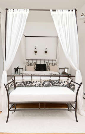 Bed with curtain in modern interior の写真素材