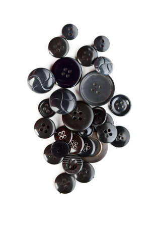 collection of various black sewing button on white background