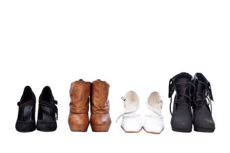 Four pairs different shoes over white background の写真素材