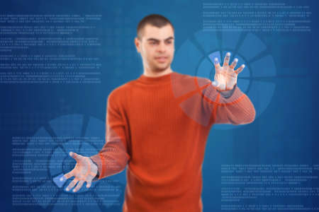 Man pressing digital button, futuristic technology in blue backgroundの写真素材