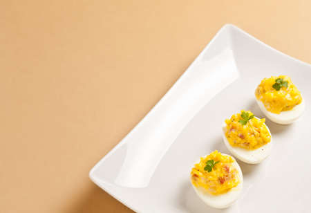 Appetizer of three stuffed eggs