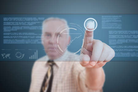 Elderly businessman pressing digital button, futuristic technology 