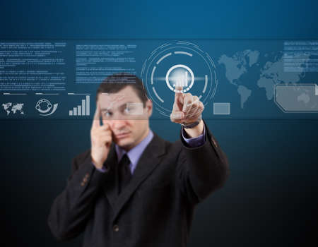 business man pressing a touchscreen button の写真素材