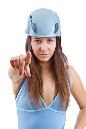 Woman in climbing helmet pointing, isolated in whiteの写真素材