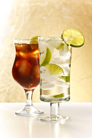 Glass of vodka whit ice and glass of colaの写真素材