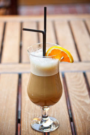 Ice coffee on a wooden table 