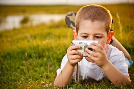 Little boy with the camera の写真素材