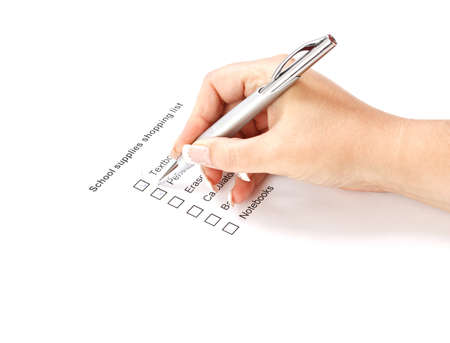Woman check school supplies shopping list の写真素材
