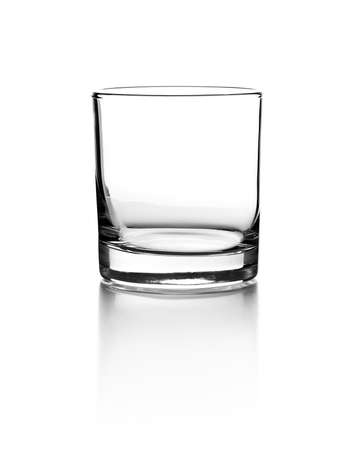 Empty glass for whiskey on white backgroundの写真素材