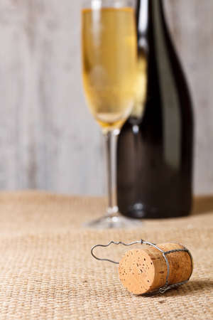 Champagne cork on rustic fabricの写真素材