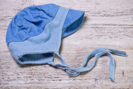 Blue cap on old painted woodの写真素材