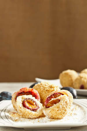 Plum dumplings coverder with breadcrumb and sprinkled with sugarの写真素材