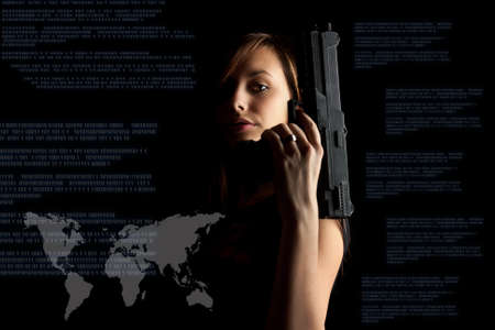 Woman in black background with gun, cyber attack, cyber terrorism, cybercrime concept. の写真素材