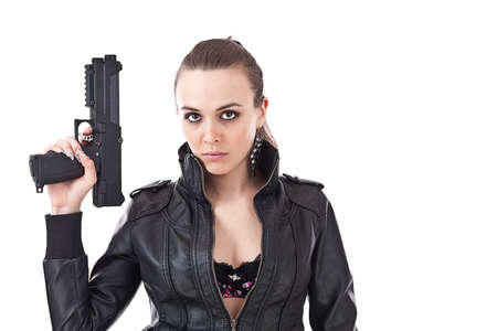 Sexy young woman with a gun isolated on white 