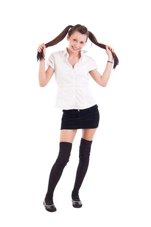 Sexy student girl posing over white background. の写真素材