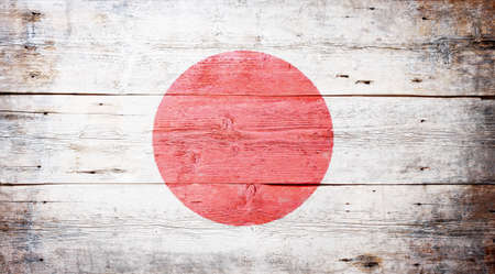 Flag of Japan painted on grungy wood plank background 
