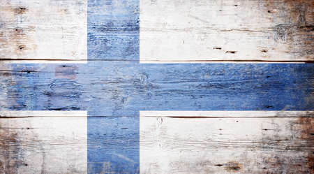 Flag of Finland painted on grungy wood plank background の写真素材