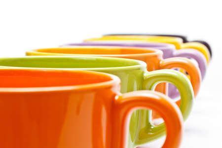 Row of color tea cupsの写真素材