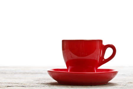Red coffee cup on wood background の写真素材