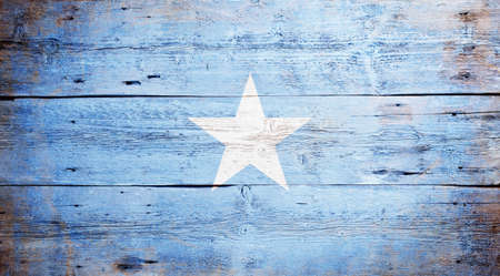 Flag of Somalia painted on grungy wood plank background の写真素材