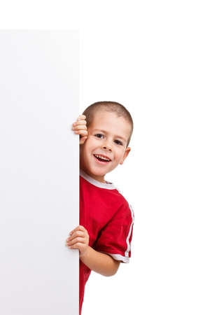 Smiling boy with board for your messageの写真素材