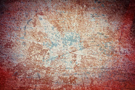 Old grunge background texture in redの写真素材