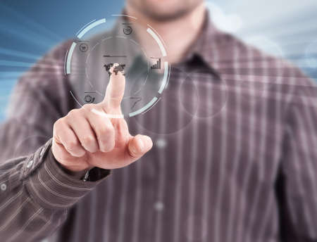 Hand pushing on a touch screen interface の写真素材