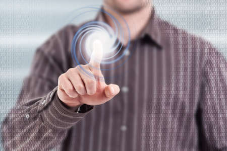 Businessman pressing modern digital buttons on a virtual background 