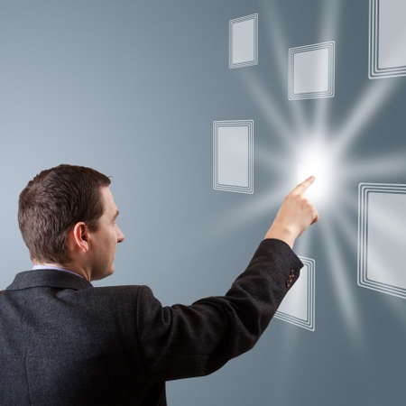 Businessman navigating interface in future の写真素材
