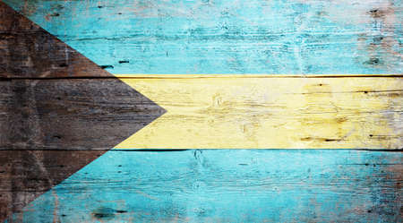 Flag of the Bahamas painted on grungy wood plank background の写真素材
