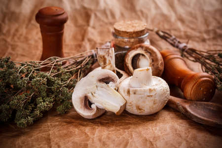 Raw mushrooms on rustic backgroundの写真素材