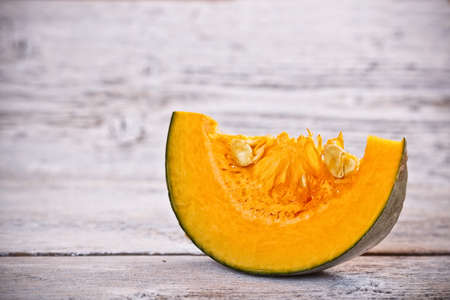 Autumn still life with sliced pumpkinsの写真素材