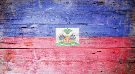 Flag of Haiti painted on grungy wood plank background の写真素材
