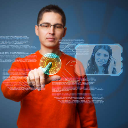 Young man using digital interface to connecting helplineの写真素材
