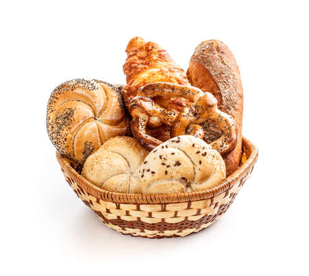 Various breads in basket on white backgroundの写真素材