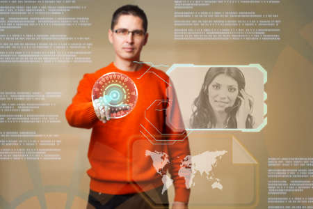 Young man using digital interface to communicate の写真素材