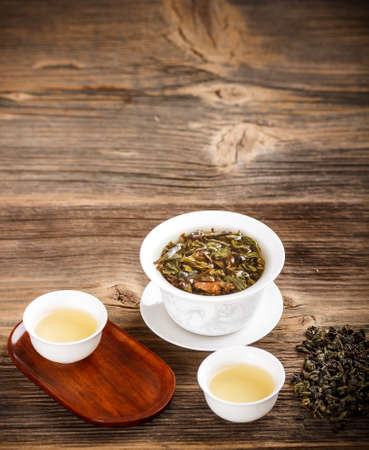 Chinese lidded bowl on old wooden tableの写真素材