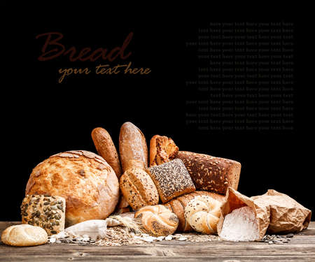 Variety of bread on black backgroundの写真素材