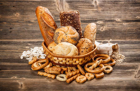 Composition with bread and rolls in wicker basket の写真素材
