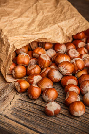 Tasty hazelnuts spelling from the paper bag