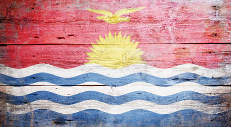Flag of Kiribati painted on grungy wood plank background の写真素材