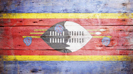 Flag of Swaziland painted on grungy wood plank background の写真素材
