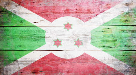 Flag of Burundi painted on grungy wood plank backgroundの写真素材